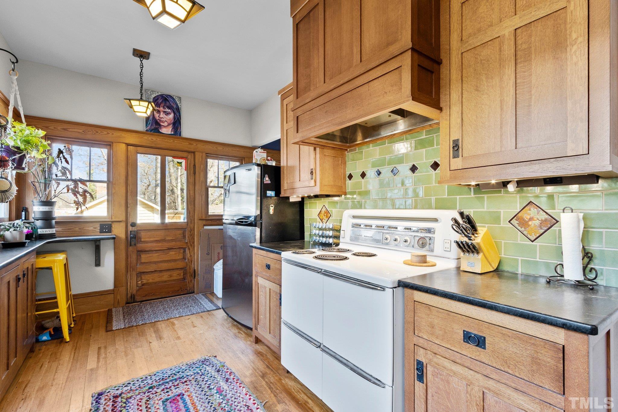 543 East Jones Street Raleigh, NC 27601 - Photo 12 of 31 a kitchen with refrigerator and window