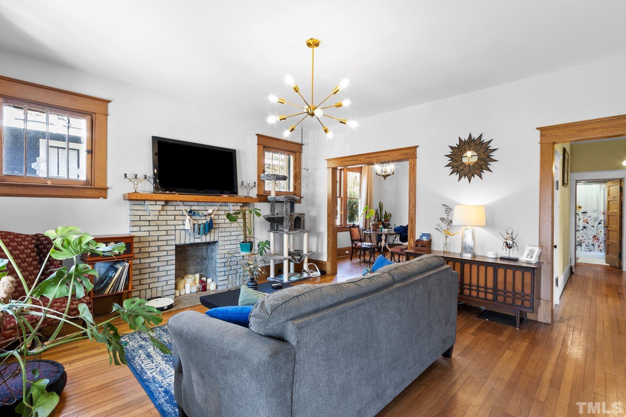 543 East Jones Street Raleigh, NC 27601 - Photo 6 of 31 a living room with furniture fireplace and flat screen tv