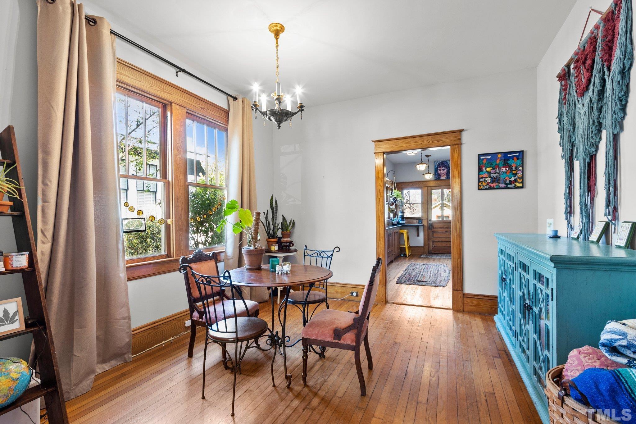 543 East Jones Street Raleigh, NC 27601 - Photo 8 of 31 a view of a dining room with furniture window and wooden floor