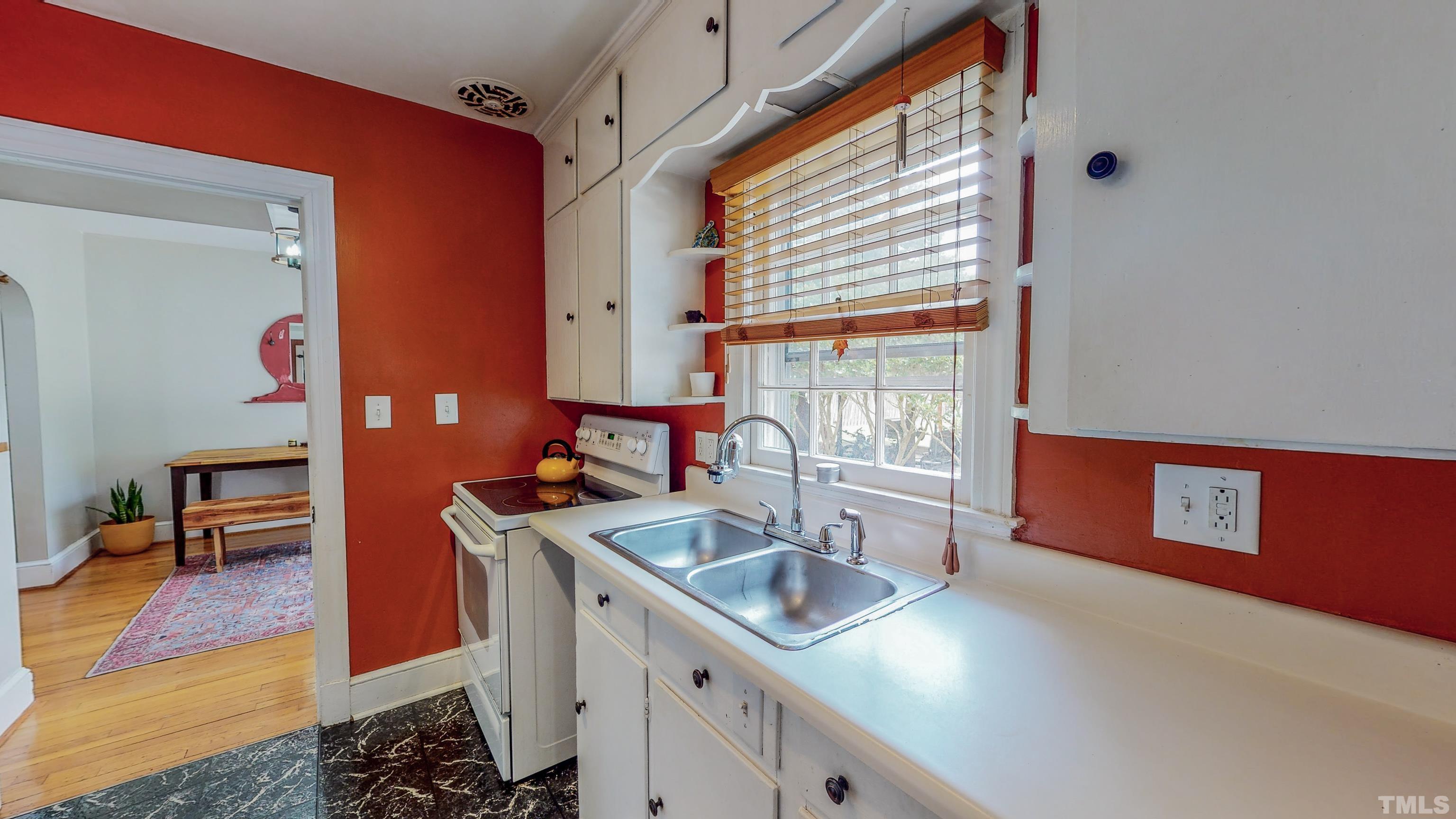 500 Gordon Street Roxboro, NC 27573 - Photo 14 of 70 a kitchen with stainless steel appliances granite countertop a sink stove and cabinets