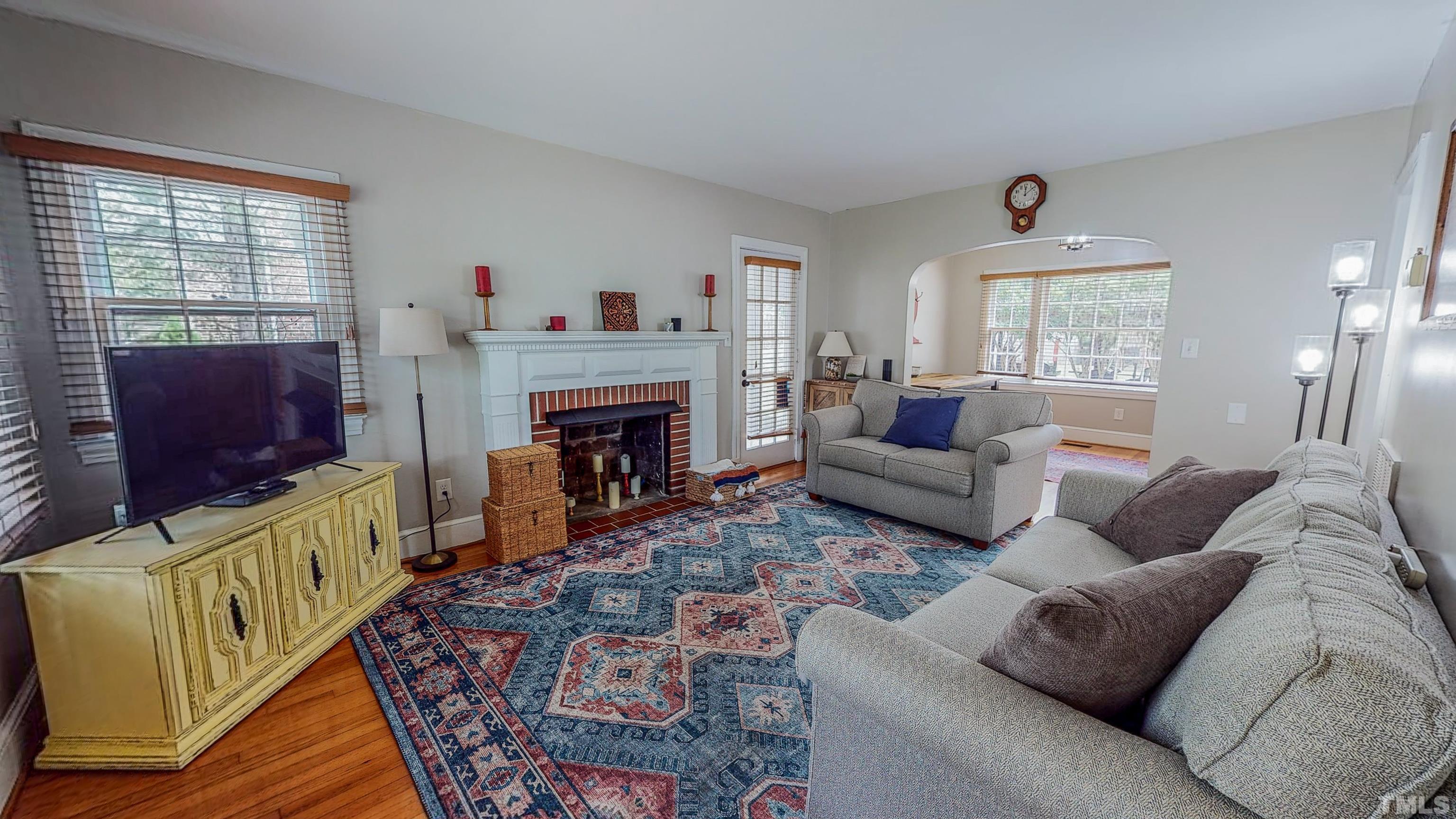500 Gordon Street Roxboro, NC 27573 - Photo 2 of 70 a living room with furniture and a fireplace