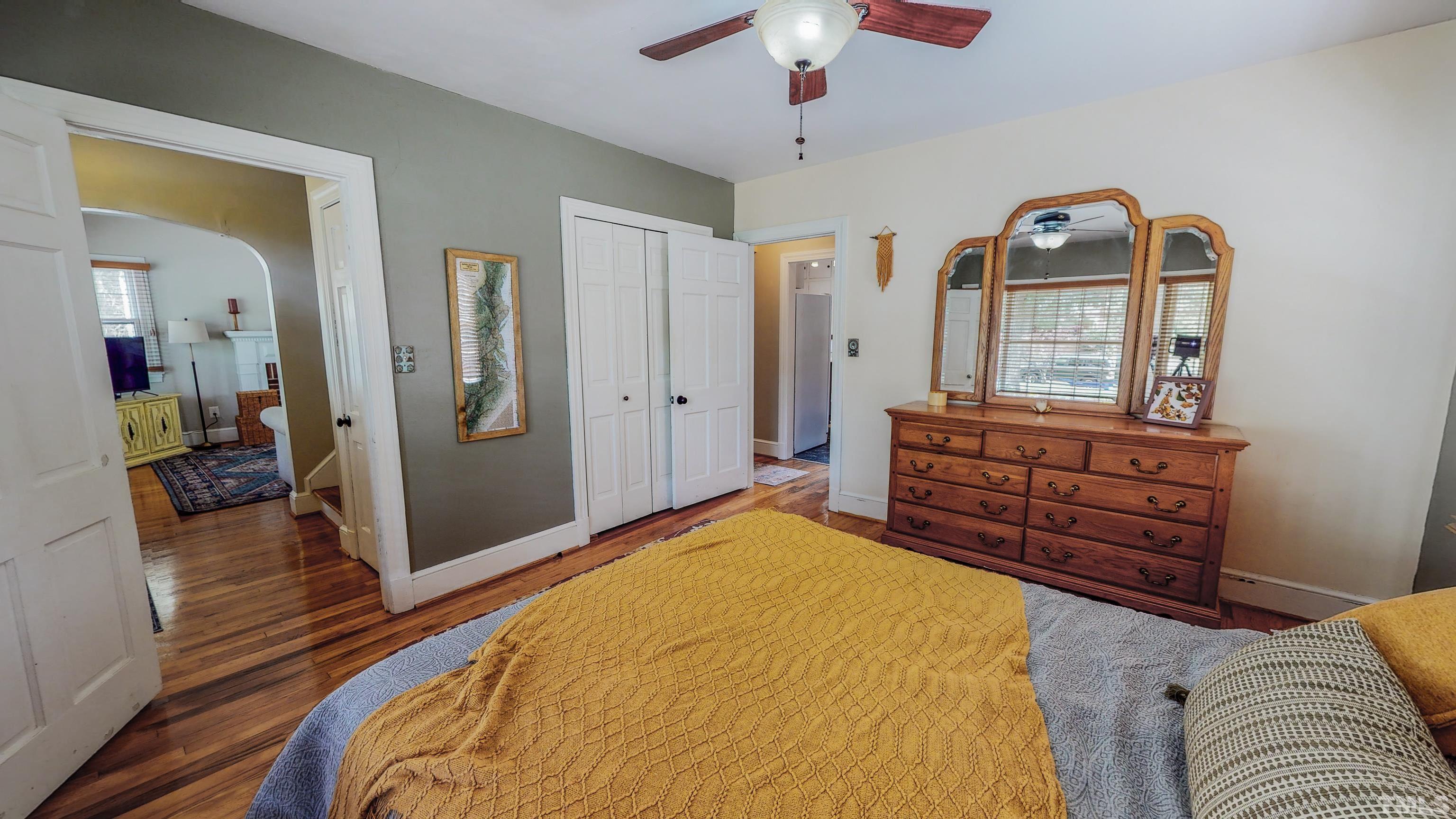 500 Gordon Street Roxboro, NC 27573 - Photo 22 of 70 a bedroom with a bed and a chandelier
