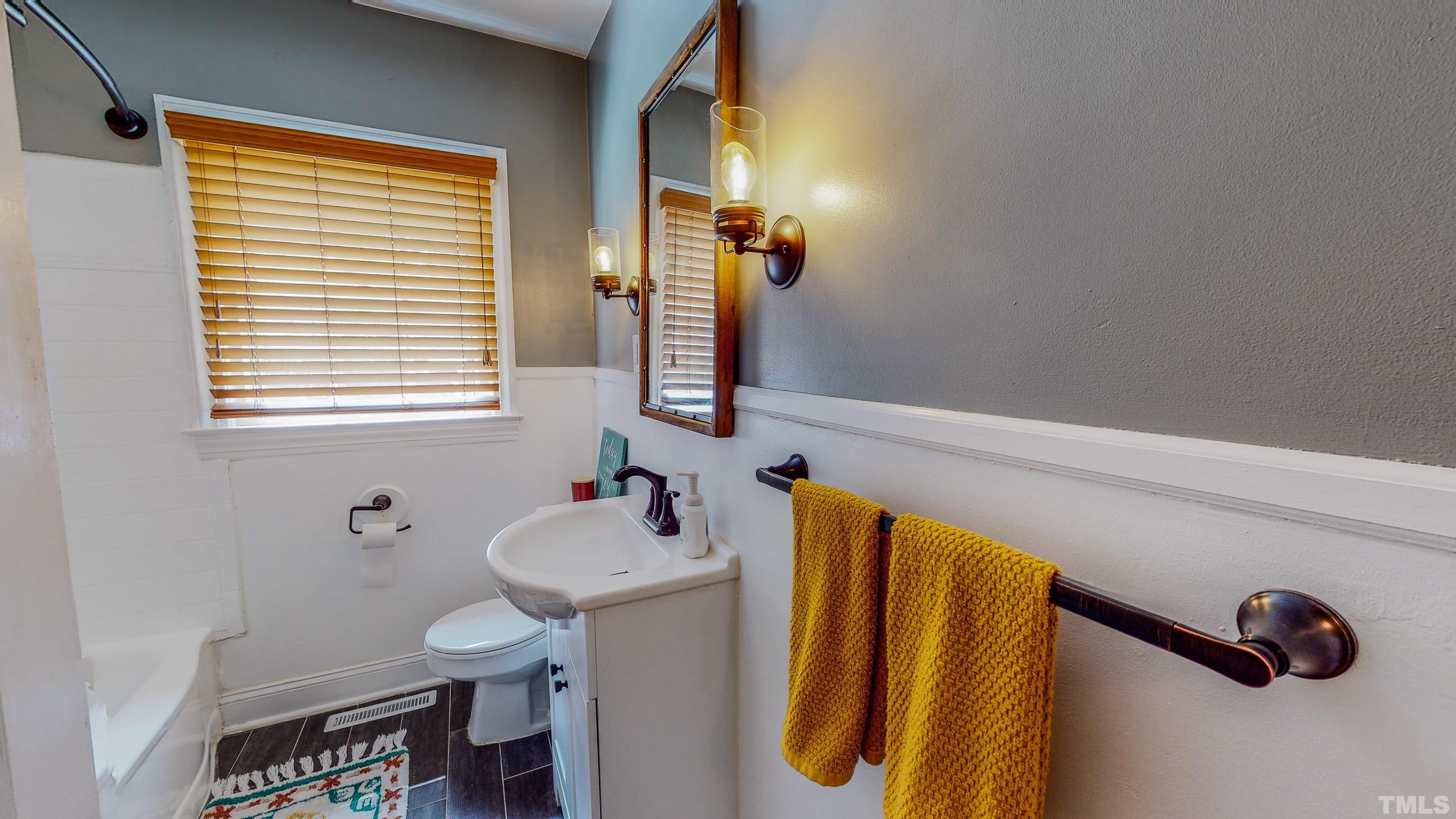 500 Gordon Street Roxboro, NC 27573 - Photo 23 of 70 a bathroom with a sink and a toilet