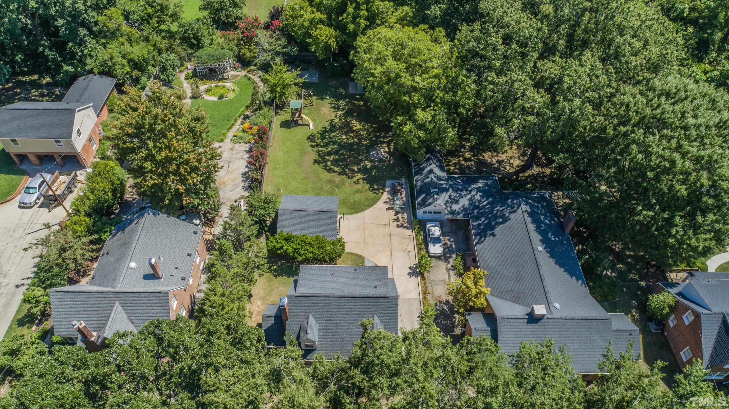 500 Gordon Street Roxboro, NC 27573 - Photo 48 of 70 an aerial view of a house with a yard and garden