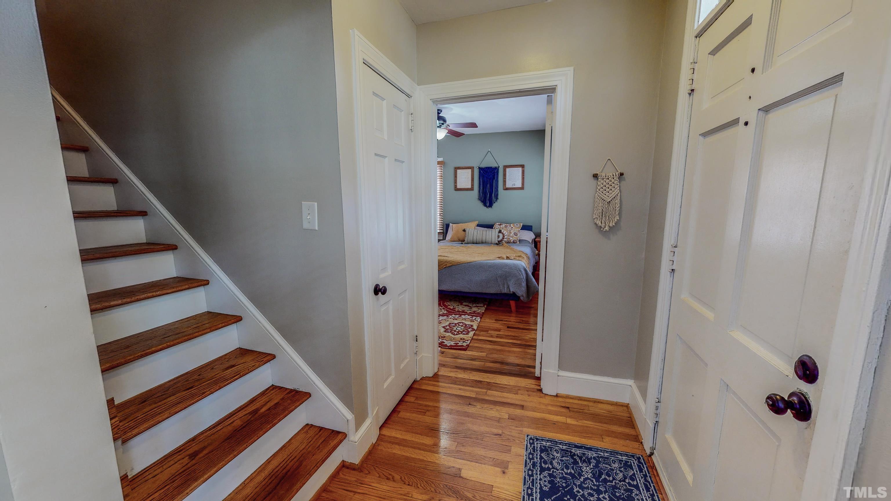 500 Gordon Street Roxboro, NC 27573 - Photo 59 of 70 a view of a hallway with wooden floor and a bathroom