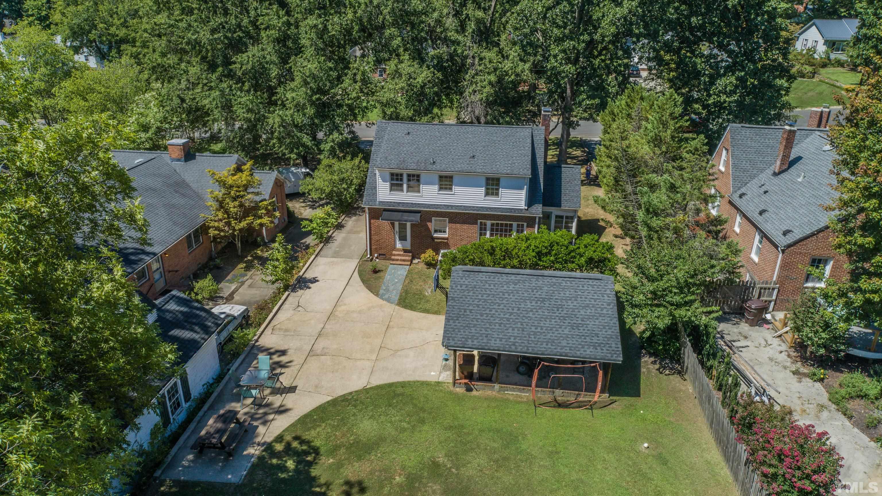 500 Gordon Street Roxboro, NC 27573 - Photo 8 of 70 an aerial view of a house with table and chairs and a patio