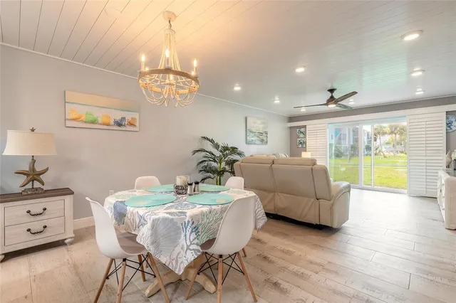 a kitchen with stainless steel appliances kitchen island granite countertop a refrigerator and a sink
