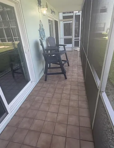 a view of a balcony with furniture