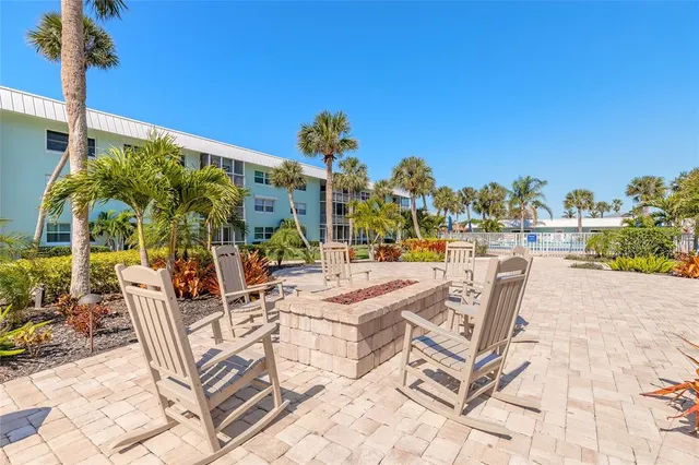 a view of a chairs and table in a terrace