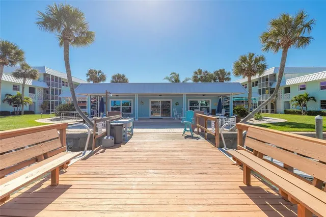 a living room with furniture kitchen view and a table