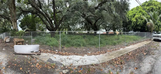 a view of a backyard with trees