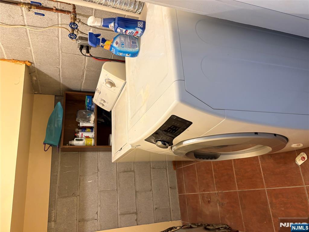 233 Myrtle Avenue, Unit A Fort Lee, NJ 07024 - Photo 9 of 11 a utility room with dryer and washer