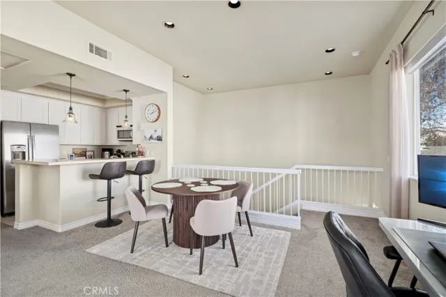 a view of a dining room with furniture