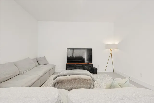 a bathroom with a granite countertop shower sink and vanity