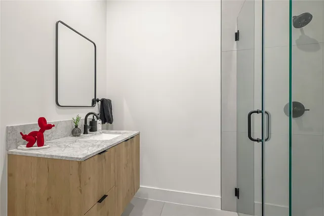 a bathroom with a sink and mirror