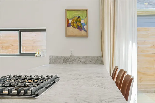 a kitchen with a sink and a stove top oven