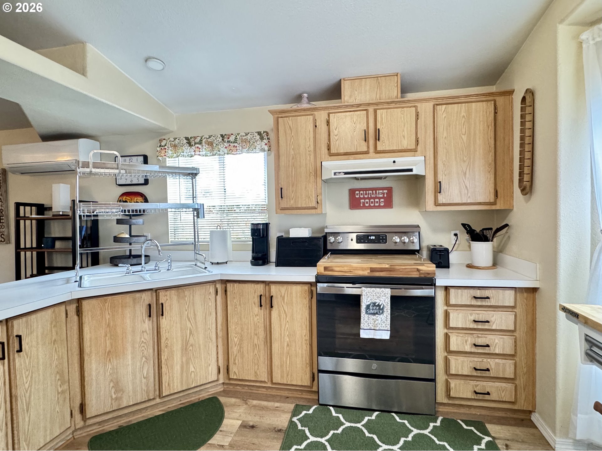 3760 Highway 101, Unit 1 Florence, OR 97439 - Photo 23 of 32 a kitchen with stainless steel appliances granite countertop a stove and a sink