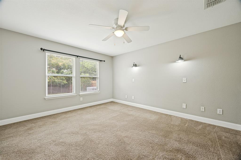 1601 Elm Street Anna, TX 75409 - Photo 13 of 25 an empty room with a window and a fan