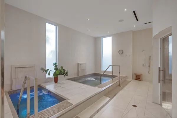 a bathroom with a sink and a large mirror