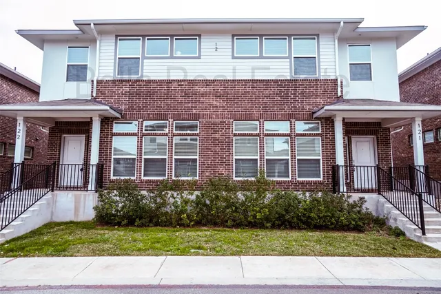 a house view with a garden space