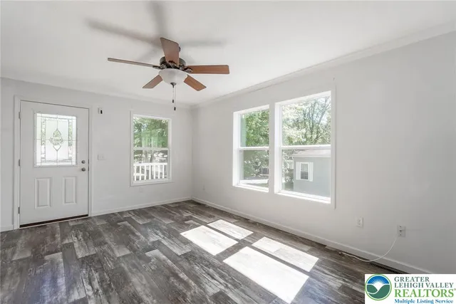 a view of an empty room with a window
