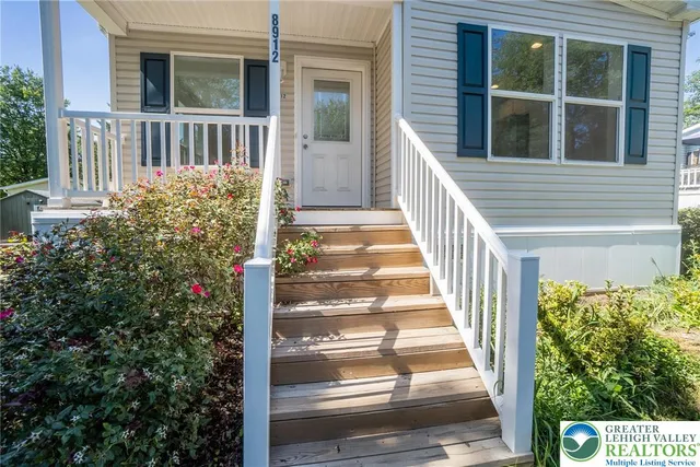 a view of a house with a small yard