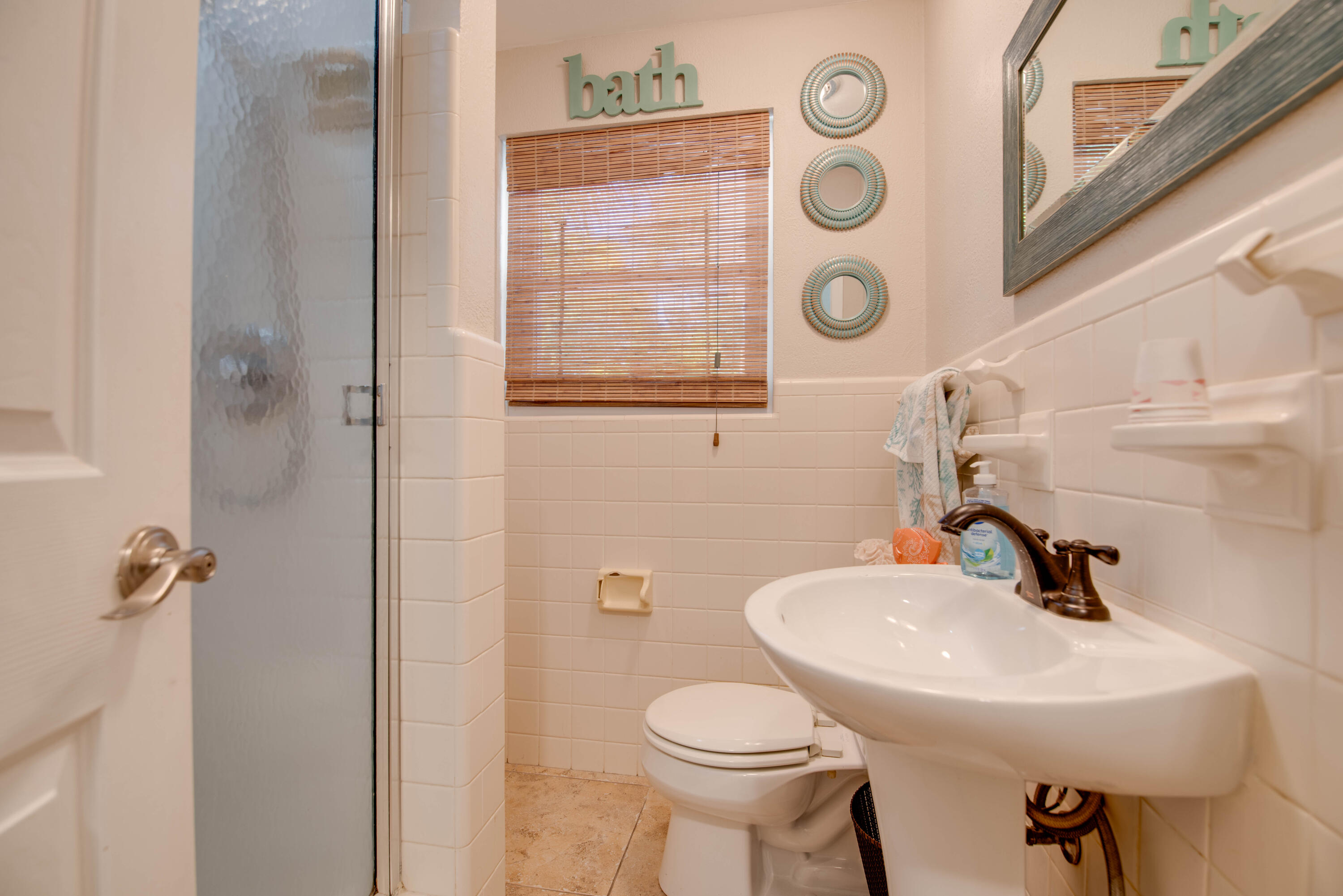 29013 Marigold Drive Big Pine Key, FL 33043 - Photo 12 of 52 a bathroom with a toilet sink and mirror