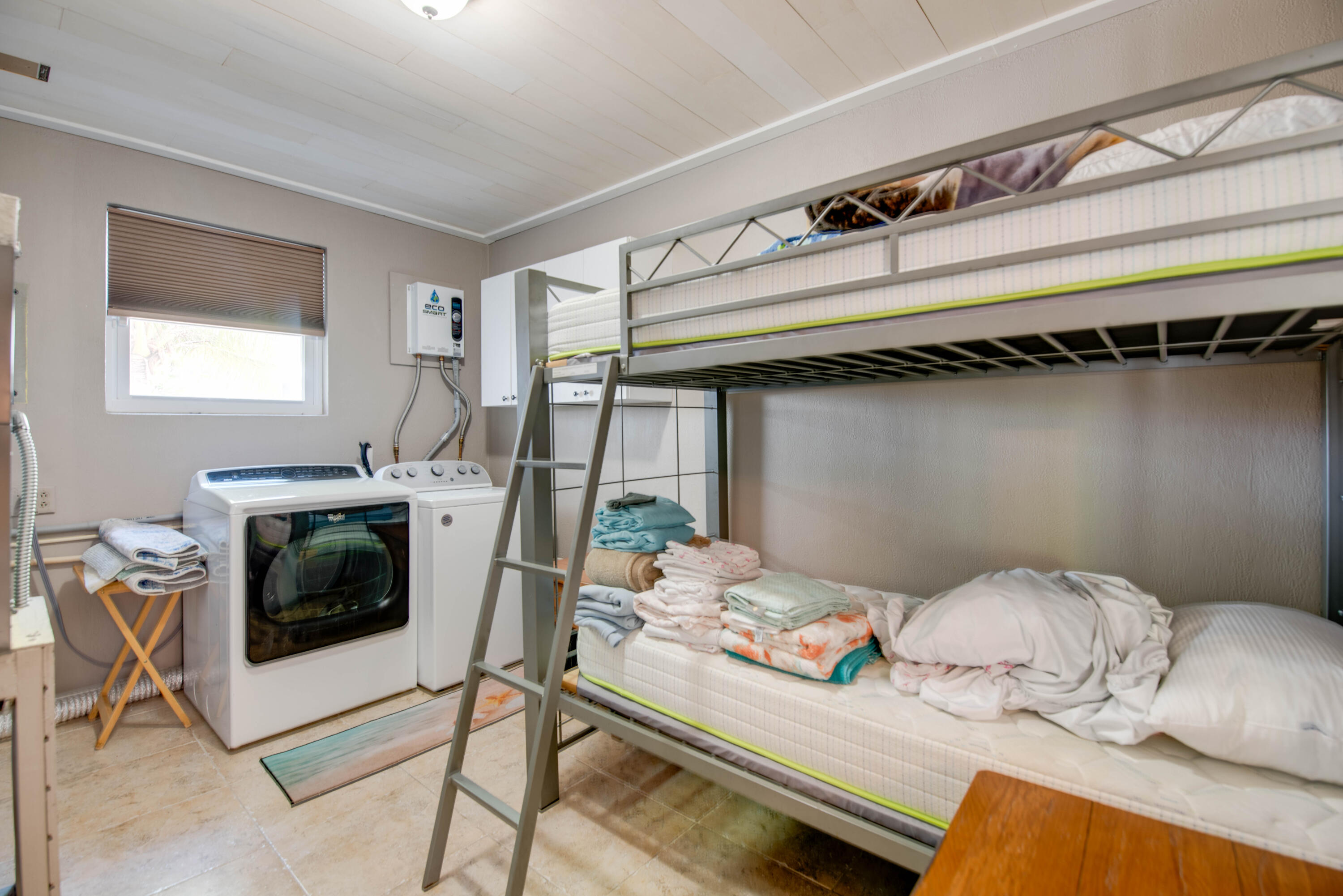 29013 Marigold Drive Big Pine Key, FL 33043 - Photo 14 of 52 a bedroom with a bed and a window