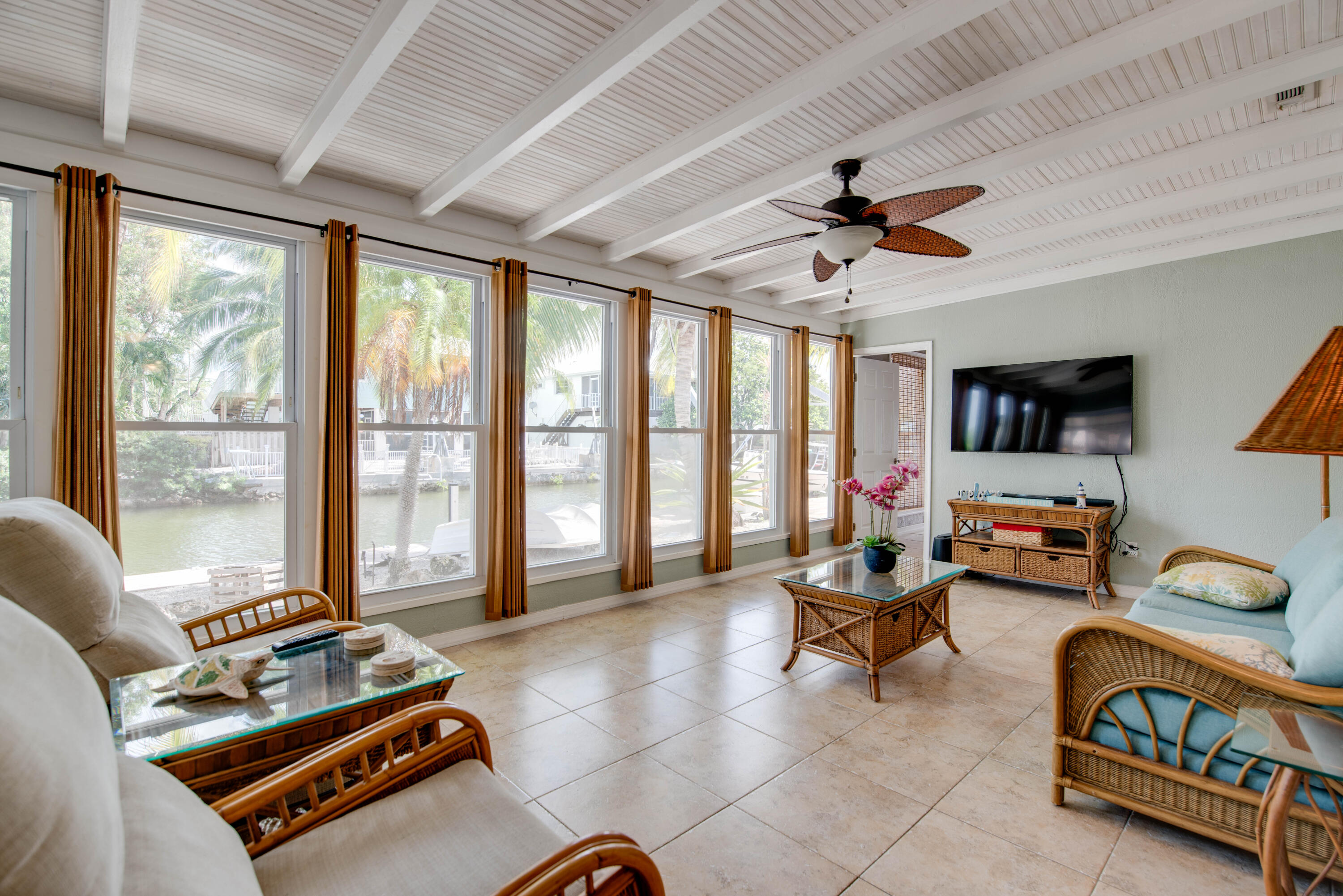 29013 Marigold Drive Big Pine Key, FL 33043 - Photo 17 of 52 a living room with furniture and a floor to ceiling window