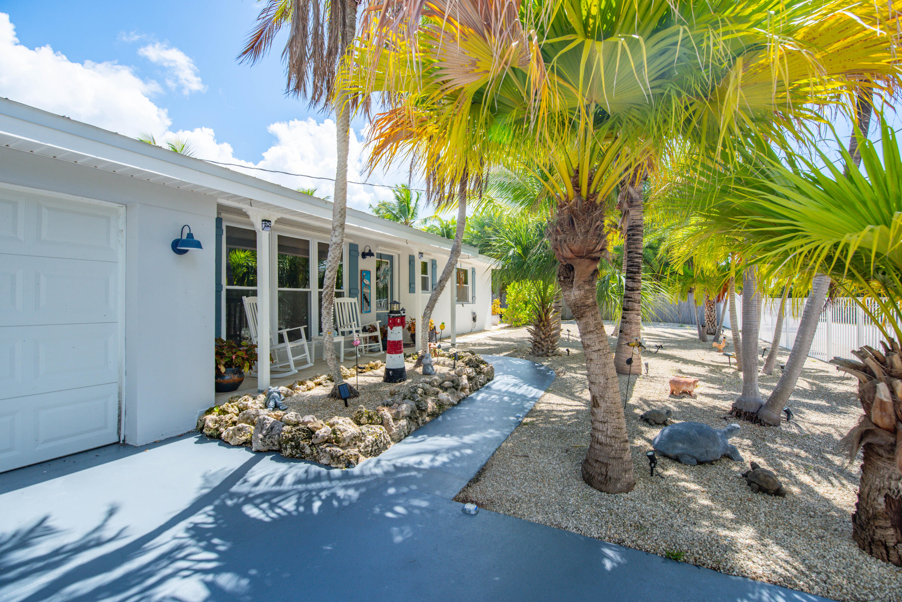 29013 Marigold Drive Big Pine Key, FL 33043 - Photo 45 of 52 a view of a backyard with table and chairs potted plants