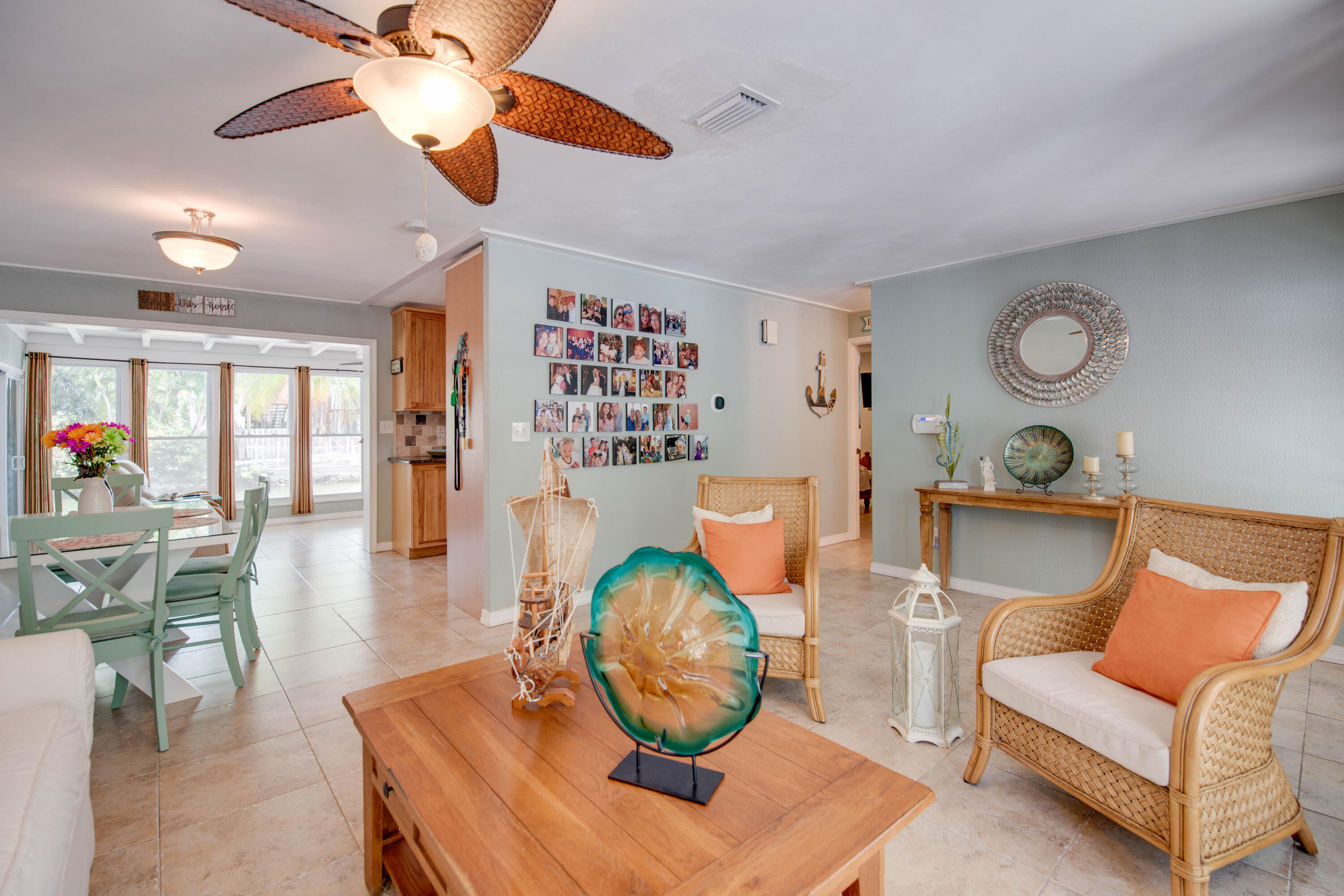 29013 Marigold Drive Big Pine Key, FL 33043 - Photo 7 of 52 a living room with furniture a rug and a chandelier
