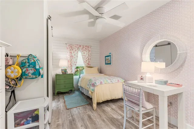 a bedroom with a bed furniture and a window