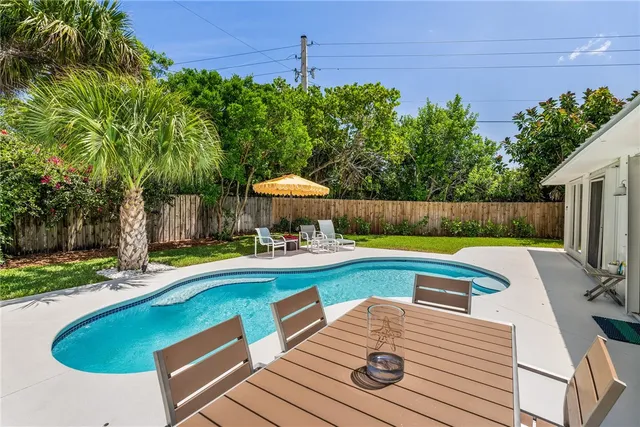a view of a swimming pool with a patio
