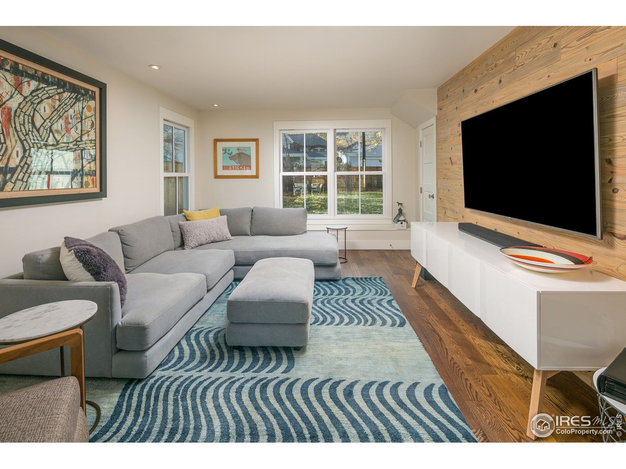 3221 8th Street Boulder, CO 80304 - Photo 12 of 39 Family room, beetle kill accent wall