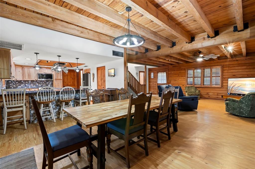 809 Cardinal Avenue Palm Harbor, FL 34683 - Photo 12 of 66 a view of a dining room with furniture window and wooden floor