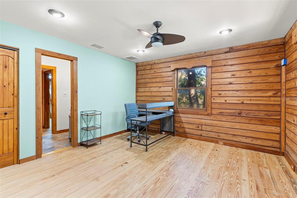 809 Cardinal Avenue Palm Harbor, FL 34683 - Photo 18 of 66 a view of a workspace with furniture and a window