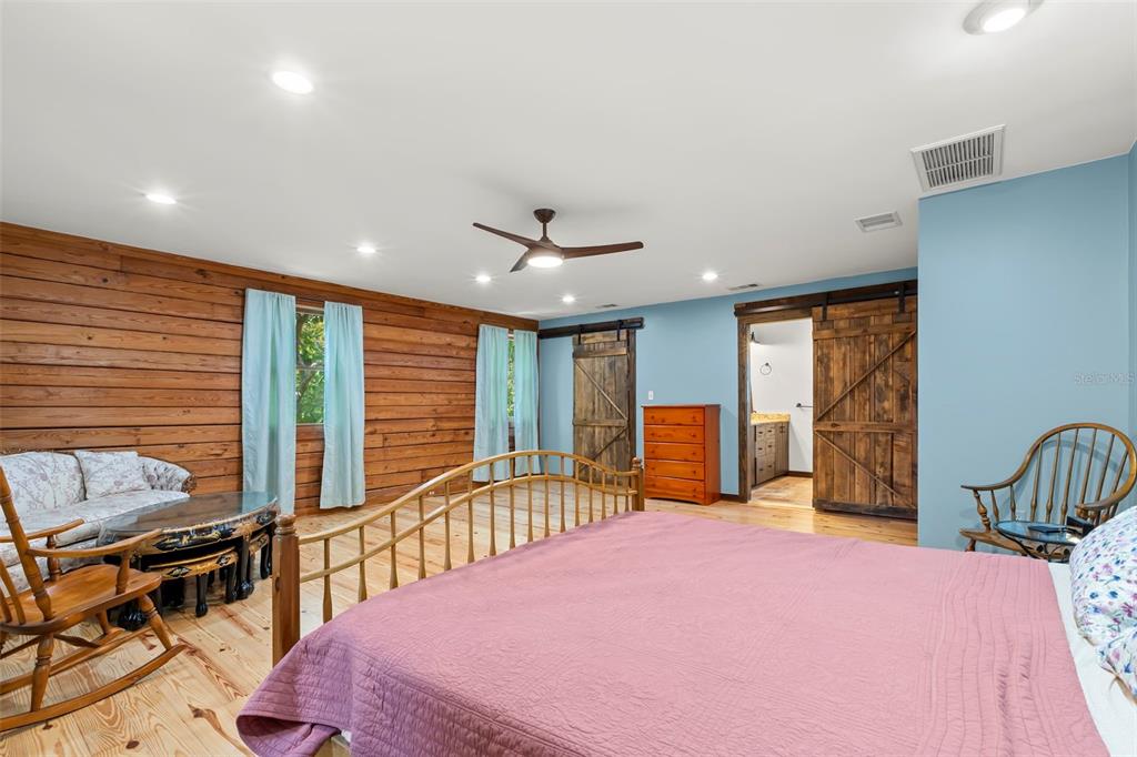 809 Cardinal Avenue Palm Harbor, FL 34683 - Photo 26 of 66 a bedroom with furniture and large window