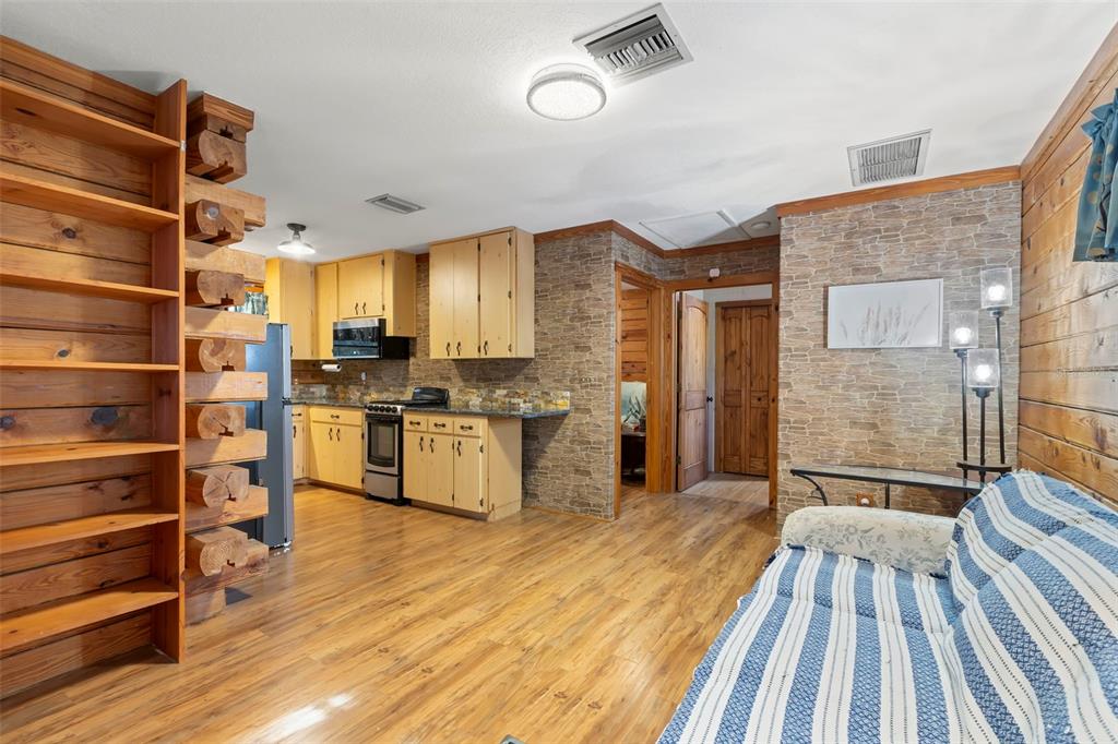 809 Cardinal Avenue Palm Harbor, FL 34683 - Photo 41 of 66 a view of kitchen with cabinets and wooden floor