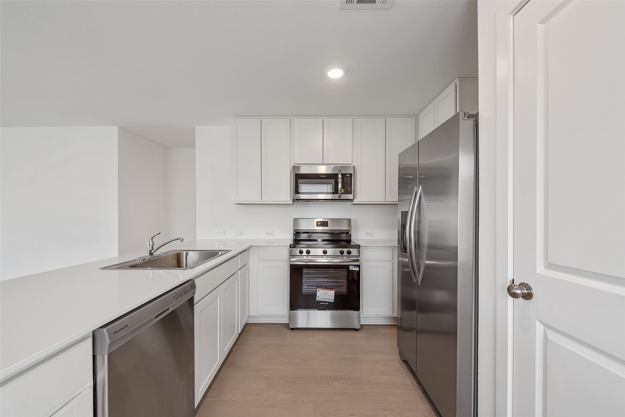 18739 Barrichello Drive Conroe, TX 77306 - Photo 6 of 15 a kitchen with a sink and stainless steel appliances