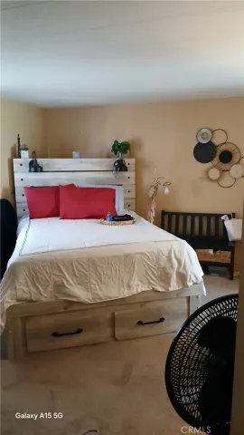 a bedroom with a bed and window