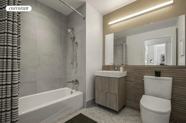 a bathroom with a granite countertop toilet a sink and bathtub