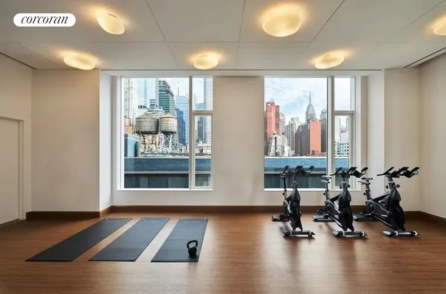 a living room with furniture and large windows