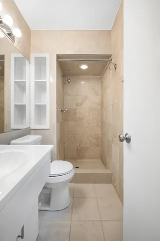 a bathroom with a bathtub and toilet