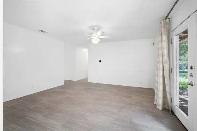 a view of an empty room with a window