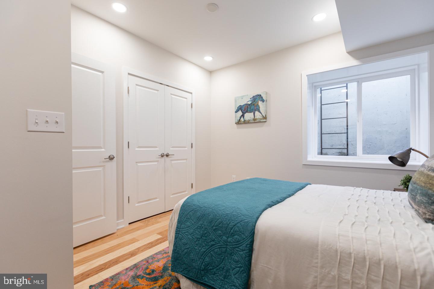 1322 Hope Street, Unit A Philadelphia, PA 19122 - Photo 21 of 30 a bedroom with a bed and a window