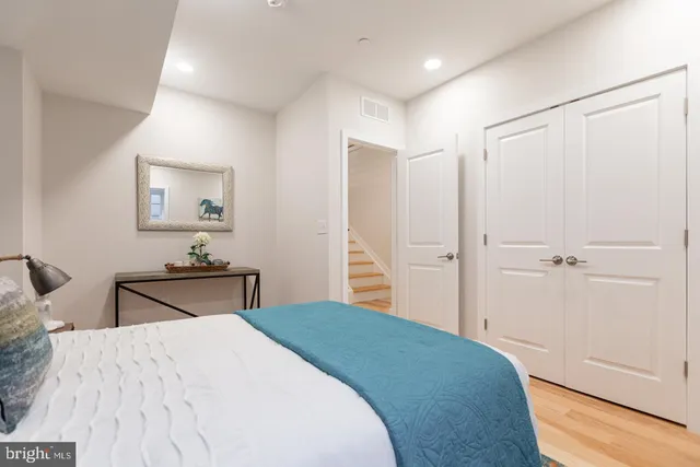 a bedroom with a bed and a table