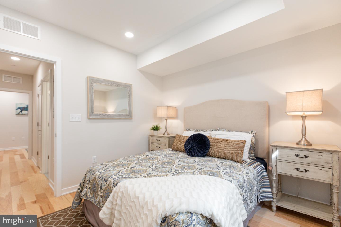 1322 Hope Street, Unit A Philadelphia, PA 19122 - Photo 23 of 30 a bedroom with a bed and a night stand