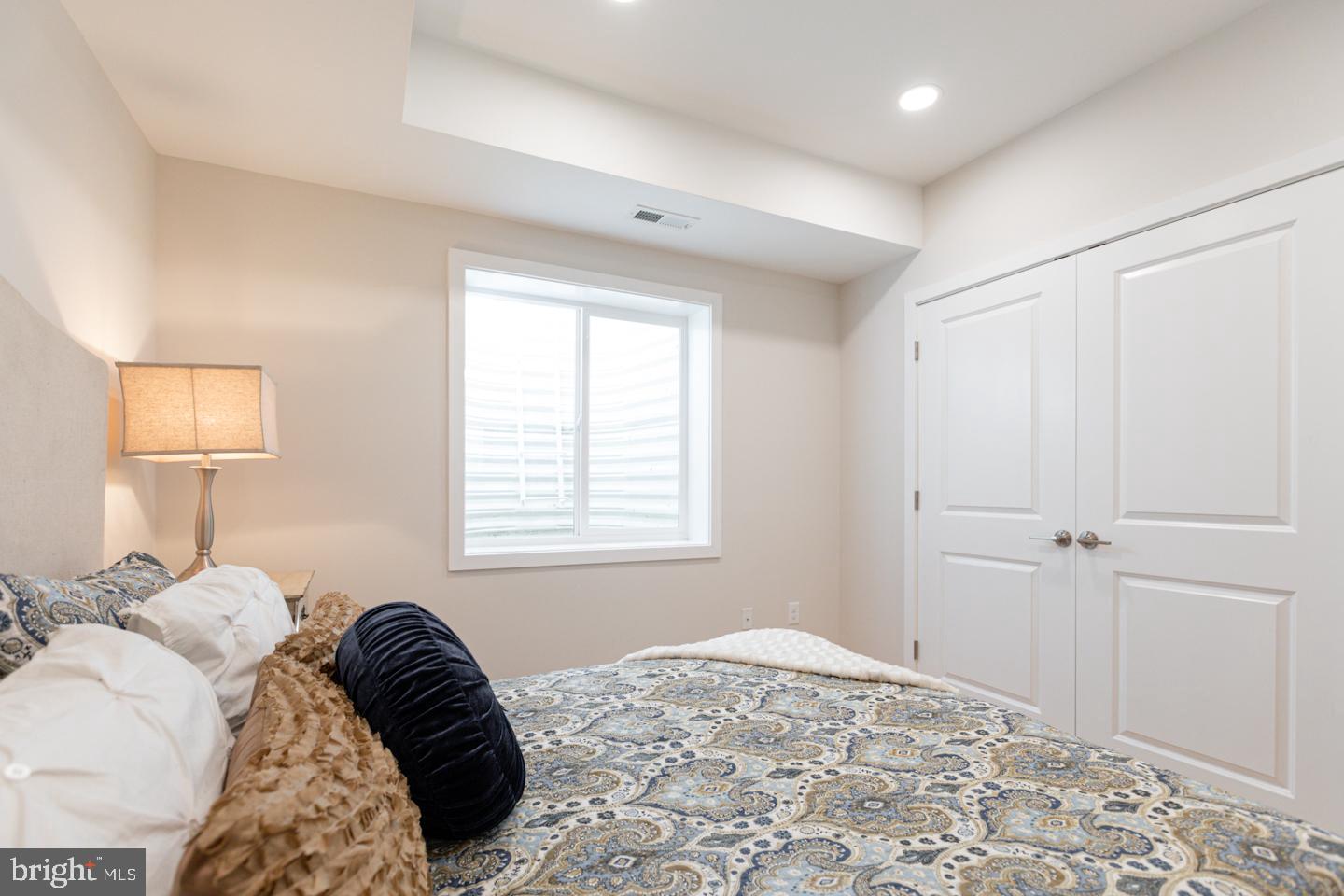 1322 Hope Street, Unit A Philadelphia, PA 19122 - Photo 25 of 30 a bedroom with a bed and a window