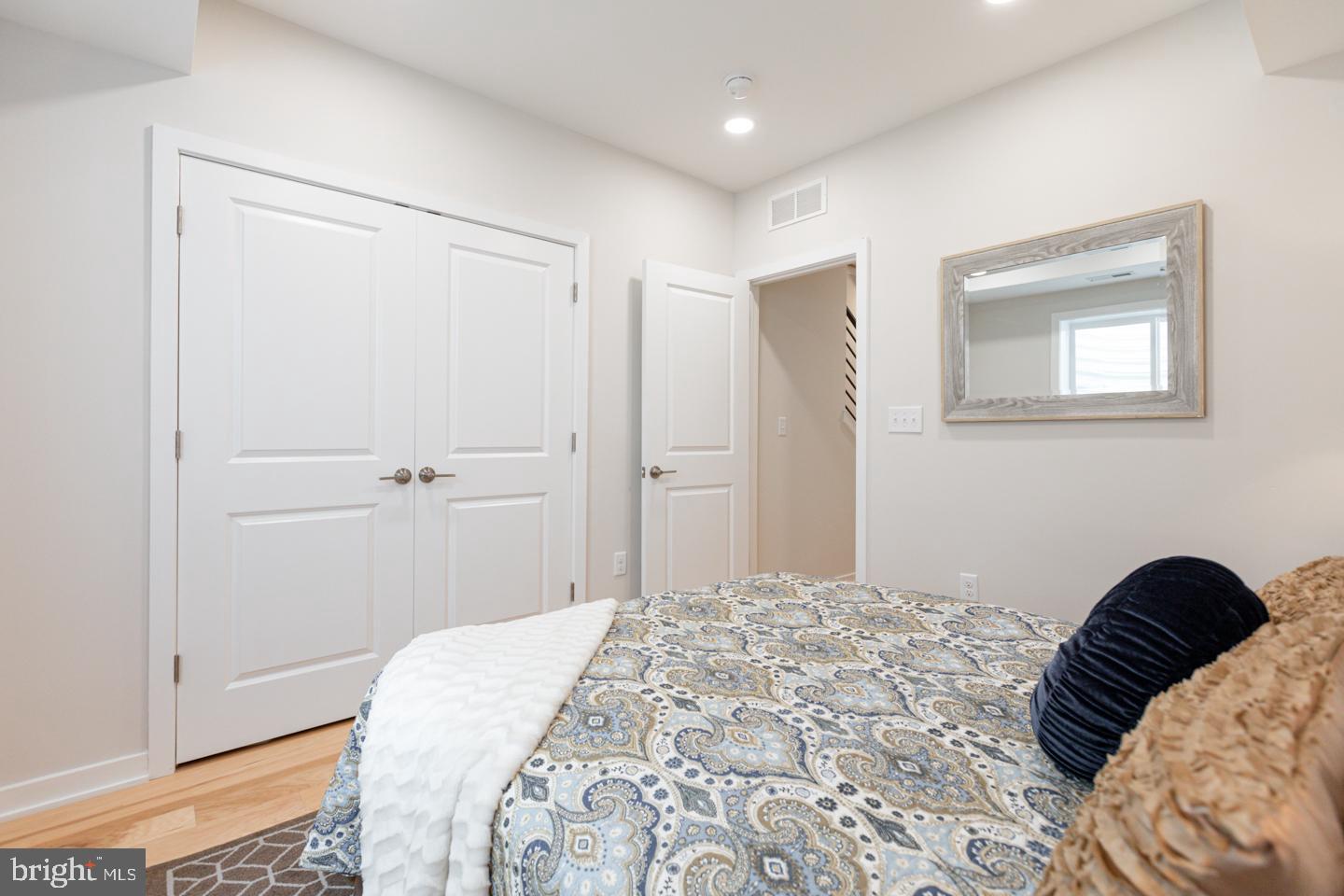 1322 Hope Street, Unit A Philadelphia, PA 19122 - Photo 26 of 30 a bedroom with a bed and a closet