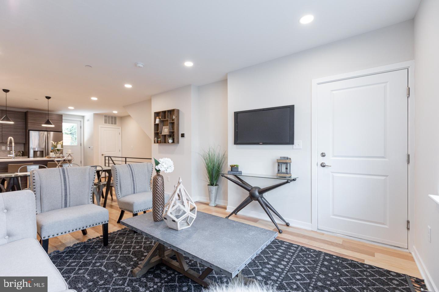 1322 Hope Street, Unit A Philadelphia, PA 19122 - Photo 3 of 30 a living room with furniture and a flat screen tv